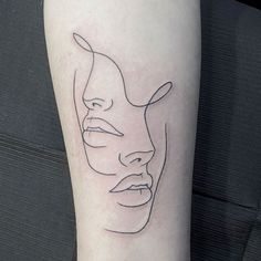 a woman's face on the left side of her leg, with lines drawn across it