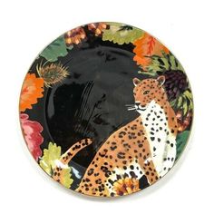 a plate with a leopard and flowers on it