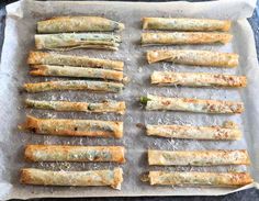 some food is laying out on a baking sheet and ready to be cooked in the oven