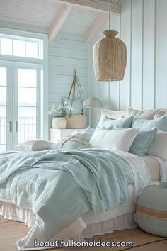 a bedroom with white walls and blue bedding