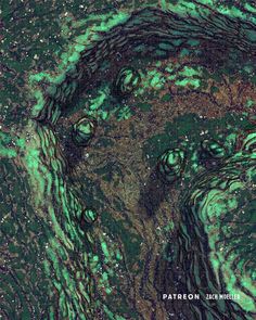 an aerial view of the earth's surface with green and brown algae on it