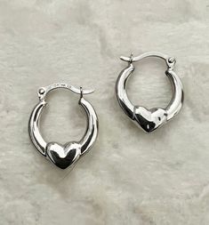 Description: Elevate your style with our 10K Real White Gold Heart Huggie Hoop Earrings, featuring a modern twist with delicate beads for added texture and dimension. These minimalist 15mm/.60" hoops are both polished and satin-finished, striking a perfect balance between classic and contemporary. Lightweight and comfortable, they are ideal for everyday wear and special occasions. Crafted from high-quality 10K white gold, these Heart Huggie Hoop Earrings add a touch of luxury to any jewelry collection. The small, delicate design ensures versatility, making them perfect for any outfit. Their timeless elegance makes these earrings a cherished accessory for any style-conscious individual. Product Specification: ------------------------------- • Metal: 10K Gold • Finish: Polished and Satin • S Earring Hoop, Gold Satin, White Gold Earrings, White Gold Jewelry, Huggie Hoop Earrings