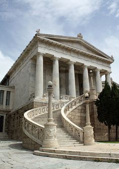 an old building with stairs leading up to it