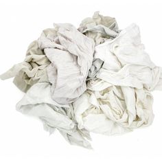 a pile of white cloth sitting on top of a white floor next to each other