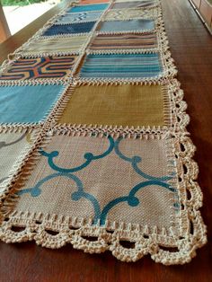 a table runner made out of different colored fabrics