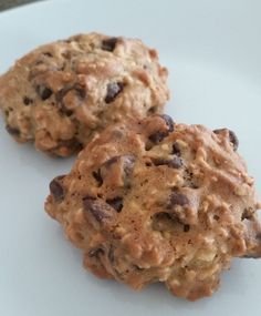 two cookies sitting on top of a white plate