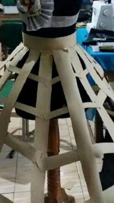 a wooden stool made to look like a dress