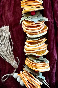 a stack of pancakes sitting on top of a table next to a ball of string