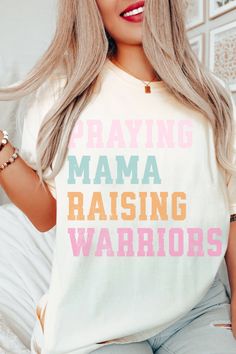 Discover the perfect gift for the Christian mom in your life! This 'Praying Mama Raising Warriors' t-shirt is not only stylish but also carries a powerful message. Made with the ever-so-soft, comfort colors tees and available in various sizes, it's a thoughtful and memorable way for her to show her faith in style. Don't miss the chance – grab one for your Christian mom or wife today! #motherdaygift #giftformom #christianmom #christianshirts #christianliving #christianapparel #faithbasedapparel White Graphic Print Tops For Family Gatherings, White Soft-washed Top For Mother's Day, Casual White Tops For Family Gatherings, White Letter Print Top For Family Gatherings, White Cotton Tops For Awareness Events, White Tops With Letter Print For Family Gatherings, Christian Clothing Men, Christian Mom Gifts, Christian Clothing Brand