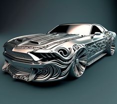 a silver car with intricate designs on it's hood is shown in this image