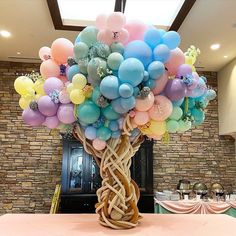 a bunch of balloons that are on top of a table