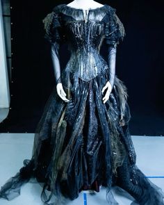 a dress made out of plastic and feathers