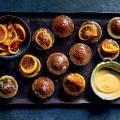 some oranges and other food on a tray