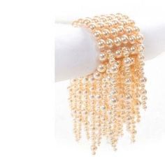 If you wish to achieve a stunning party look with something a little different, our Okore Multistrand Cluster Bracelet will not disappoint! Incorporating stunning Brown Wood beads of light and dark shades, and Pearl this cluster vine bracelet oozes style and panache. Is elastic threads is versatile to fit different hand sizes. It has been skillfully put together, with careful detail to attention, by our dedicated and capable artisans. Pair this stunning article with our breathtaking Bronze/Golde Party Pearl White Beaded Bracelets With Pearl Chain, Party Pearl White Beaded Bracelets, Pearl Charm Bracelet For Party, Pearl White Bracelets With Pearl Drop For Party, Party Pearl Bracelets With Pearl Chain, Pearl White Bracelet With Pearl Drop For Party, Pearl Bracelets With Pearl Charm For Parties, Party Pearl Bracelet With Beaded Details, Elegant Pearl Charm Bracelet For Parties