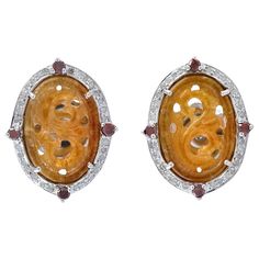 These hand carved Jade earrings are crafted in 18-karat gold and sterling silver. It is set in 4.35 carats of Jade and .48 carats of glimmering diamonds. FOLLOW MEGHNA JEWELS storefront to view the latest collection & exclusive pieces. Meghna Jewels is proudly rated as a Top Seller on 1stDibs with 5 star customer reviews. All items manufactured by us are handmade and can be customized or redesigned. Composition Size-19X15 MM Total Weight-5.02 Gold Weight(Gms)-1.43 Silver Weight(Gms)-2.624 Diamond Wt(Cts)-0.48 Jade Wt(Cts)-4.35 Kelly Rutherford, White Gold Diamond Earrings, Sapphire And Diamond Earrings, Seashell Earrings, White Gold Earrings Studs, White Gold Studs, Gold Leaf Earrings, Carved Jade, Jade Earrings