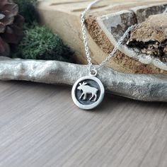 In case the shop name is not a give away enough, the moose is my favorite animal!  A Sterling Silver 15x12mm 2D framed Moose pendant on a Sterling Silver chain. Like a little round shadow box! ✭ CUSTOMIZE YOUR PIECE ✭ ►  Don't see the length you need? Check out our Custom Length Upgrade:  https://www.etsy.com/ca/listing/198366701/custom-chain-length-upgrade ► Upgrade to a Thicker Chain here: https://www.etsy.com/ca/SilverMooseArts/listing/817185940/chain-upgrade-sterling-silver-chain ► You can a Sterling Silver Necklace With Wolf Design As Gift, Silver Necklace With Wolf Design Round Pendant, Moose Jewelry, Canadian Animals, Sterling Silver Moon-shaped Charms Necklaces, Bull Moose, Owl Necklace Silver, Custom Initials, Mail Letters