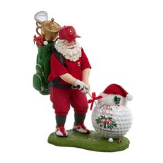 a santa clause figurine holding a golf bag with a trophy in it's hand