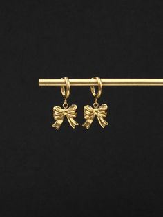 Introducing our small and delightful Bowknot Drop Earring Hoops  Crafted from stainless steel or 18K gold plated stainless steel, they offer both durability and a luxurious aesthetic. The focal point of these earrings is the adorable bowknot charms that dangle delicately from the hoops. Their petite size adds a touch of femininity and playfulness to the overall design. EARRINGS SPECIFICATIONS - size: hoops diameter - 12mm/outside and 8.5mm/inside, total earring length with charms - 28mm - stainl Stainless Steel Yellow Gold Hoop Earrings Gift, Rose Gold Plated Huggie Earrings As Gift, Gold Tarnish Resistant Huggie Earrings For Gift, Gold Tarnish Resistant Huggie Earrings As Gift, Gold Tarnish-resistant Huggie Earrings As A Gift, Silver Gold-plated Huggie Earrings Gift, Silver Gold Plated Huggie Earrings Gift, Stainless Steel Tarnish Resistant Huggie Earrings For Gifts, Gift Stainless Steel Tarnish Resistant Huggie Earrings