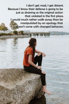 a woman sitting on top of a rock next to the ocean with a quote above her reading as human beings, we believe that we need to make changes in our lives