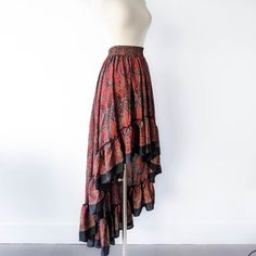 This bohemian hi low ruffle skirt is full of sway and flow. It's a graceful, romantic maxi skirt that's hits at the knee in the center front and drapes beautifully all the way around. A full twirling skirt, this can easily be paired with flats for a day at the beach, or paired with our infinity convertible tops for a more formal occasion. It's lightweight, easy to wash/dry and so easy to pack for all your vacations! Note: You will be stopped and admired when you wear this out! ► IG @ShopKulayan Cheap Flared Skirt For Beach, Cheap Flared Skirt Bottoms For Beach, Cheap Flowy Skirt For The Beach, Luxury Bohemian Multicolor Maxi Skirt, Cheap Multicolor Flowy Skirt, Maxi Skirt Formal, Bohemian Robes, Pink Bohemian, Long Floral Skirt