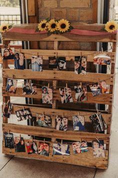 a wooden pallet with pictures and sunflowers on it