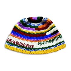 a multicolored crocheted hat on a white background