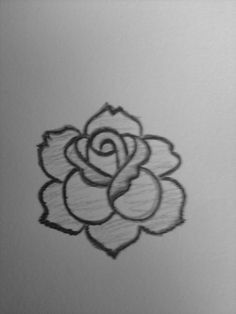 a black and white photo of a rose drawn in pencil on a piece of paper