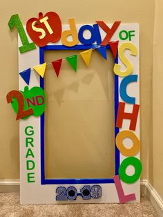 a photo frame with the words 1st day of school spelled out in multicolored letters