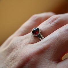 Red Crystal Birthstone Ring As Gift, Unique Ruby Birthstone Ring Gift, Red Birthstone Crystal Ring For Gift, Red Crystal Ring With Stone Setting For Anniversary, Red Crystal Ring With Stone Setting As Gift, Red Birthstone Ring With Round Stone For Gift, Red Crystal Ring With Stone Setting For Gift, Garnet Ring With Bezel Setting As Gift, Garnet Bezel Setting Ring As A Gift