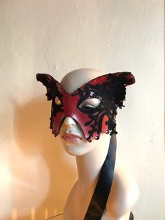 For Lepidopterists, lovers, dreamers, shamans, adventurers and witches. Red and black Butterfly mask Hand molded, hand dyed red leather Moth mask Black Silk lace details on the wings The mask is created from recycled hand molded leather and decorated with black floral lace. The edges are hand punched The back of the mask is lined with velvet, so it feels super soft against your face. The mask is super light and comfortable so you can dance the whole night away. It ties around the head with long