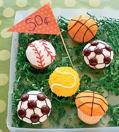 cupcakes decorated to look like sports balls