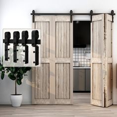 an open sliding door in a kitchen next to a potted plant on the floor