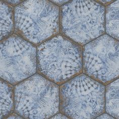 an abstract blue and brown background with hexagonal tiles in the center, which are covered in snow