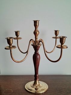 an antique brass candelabra with five candles