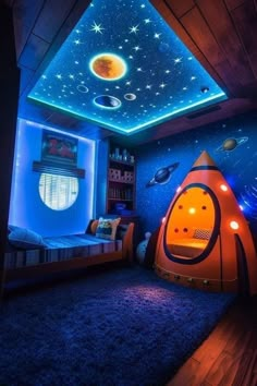 a bedroom with blue walls and stars on the ceiling is lit up by colorful lights