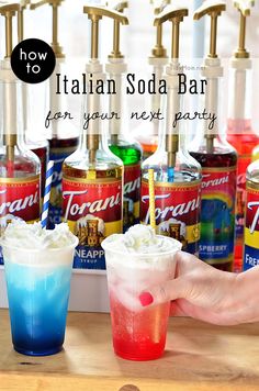 a person holding up a drink in front of several bottles with the words italian soda bar for your next party