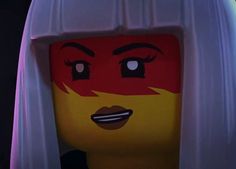 a close up of a lego character with white hair and red eyes wearing a wig