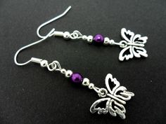 This a pair of pretty tibetan silver dangly butterfly earrings. Measure approx. 4cm from top of hook to bottom of earring. Freshly made by me and unworn. Thanks for looking!! Nickel-free Adjustable Butterfly Earrings, Adjustable Purple Metal Earrings, Adjustable Drop Earrings With Butterfly Charm, Handmade Metal Butterfly Earrings, Silver Butterfly Charm Drop Earrings, Handmade Butterfly Metal Earrings, Purple Metal Earrings, Silver Drop Earrings With Butterfly Charm, Purple Butterfly Charm Earrings For Gift