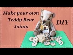 a teddy bear sitting on top of a table with lots of buttons and pegs