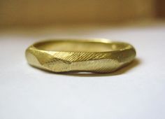 This hand made 14k gold ring can be a perfect wedding ring it has a very unique and modern presence. The ring is suited for both man and woman. will be made upon order with the needed size please note that because each ring will be custom ordered it will differ slightly from each other and from the photos, but it will be very similar and it will be one of a kind... here is a link to a similar ring in ROSE GOLD: www.etsy.com/listing/152960564/rose-gold-faceted-ring-14k-gold-ring-for?ref=shop_home Gold Faceted Stackable Wedding Rings, Perfect Wedding Ring, Mens Gold Wedding Band, Faceted Ring, Womens Wedding Bands, 14k Gold Ring, Mens Wedding Bands, Designer Jewelry, Wedding Men