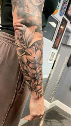 a person with a flower tattoo on their arm