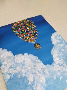 a painting of a hot air balloon floating in the sky