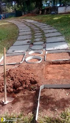 a path made out of cement blocks and dirt