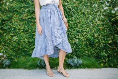 Channel your inner Laura Ingalls Wilder by sewing this Ruffled Hem DIY Wrap Skirt. With this easy wrap skirt tutorial, you can turn a classic gingham pattern into a chic contemporary look. If you don't have gingham on hand, try using brightly colored prints for a summery vibe, or simple neutral tones for a wardrobe piece that can be paired with anything. Either way, everyone will want to know where you got this gorgeous skirt! Long Wrap Skirt Pattern, How To Make A Wrap Skirt, Diy Wrap Skirt, Wrap Skirt Tutorial, Free Skirt Pattern, Sydney Fashion Week, Wrap Skirt Pattern, Ruffle Wrap Skirt, Diy Ruffle