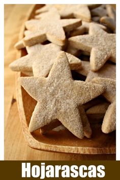 a wooden bowl filled with star shaped cookies