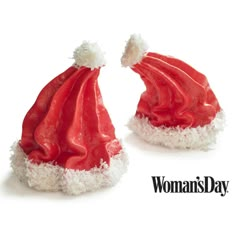 two red and white santa hats sitting on top of each other