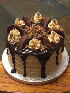 a cake with chocolate frosting and nuts on top