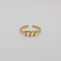 777 Angel Number Ring 18k gold filled Adjustable ring *Gold-filled jewelry is jewelry composed of a solid layer of gold (typically constituting at least 5% of the item's total weight) mechanically bonded to a base alloy). Which means like solid gold, this piece is tarnish resistant, fade resistant and water resistant. 777 Jewelry, 777 Angel Number, Angel Number, Angel Numbers, Gold Filled Jewelry, Ring Gold, Adjustable Ring, Adjustable Rings, Gold Ring