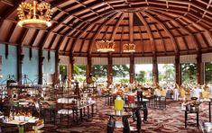 the inside of a restaurant with lots of tables and chairs set up for an event