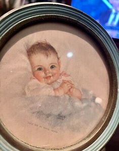 a portrait of a baby in a glass frame